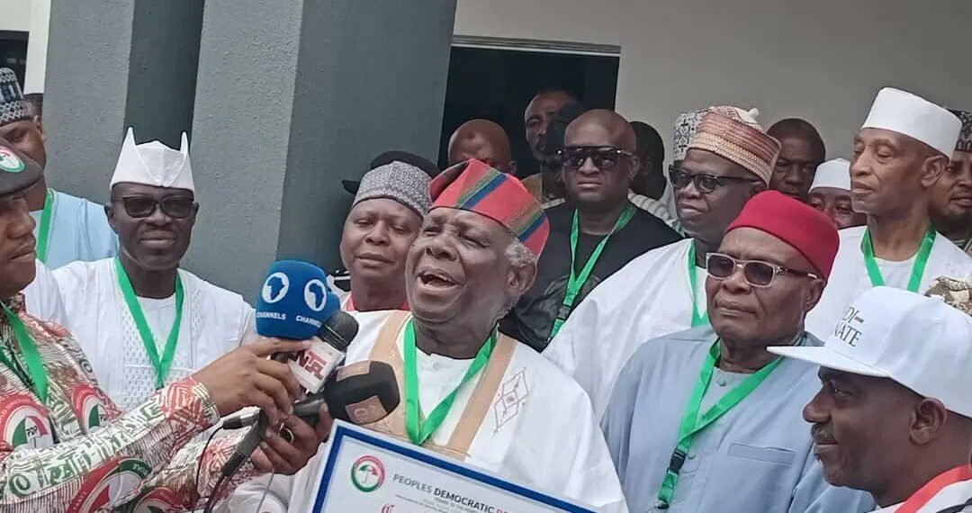 Jerry Gana Presents PDP Certificate To Jonathan 