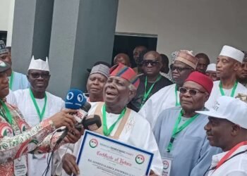Jerry Gana Presents PDP Certificate To Jonathan 