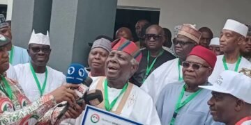Jerry Gana Presents PDP Certificate To Jonathan 