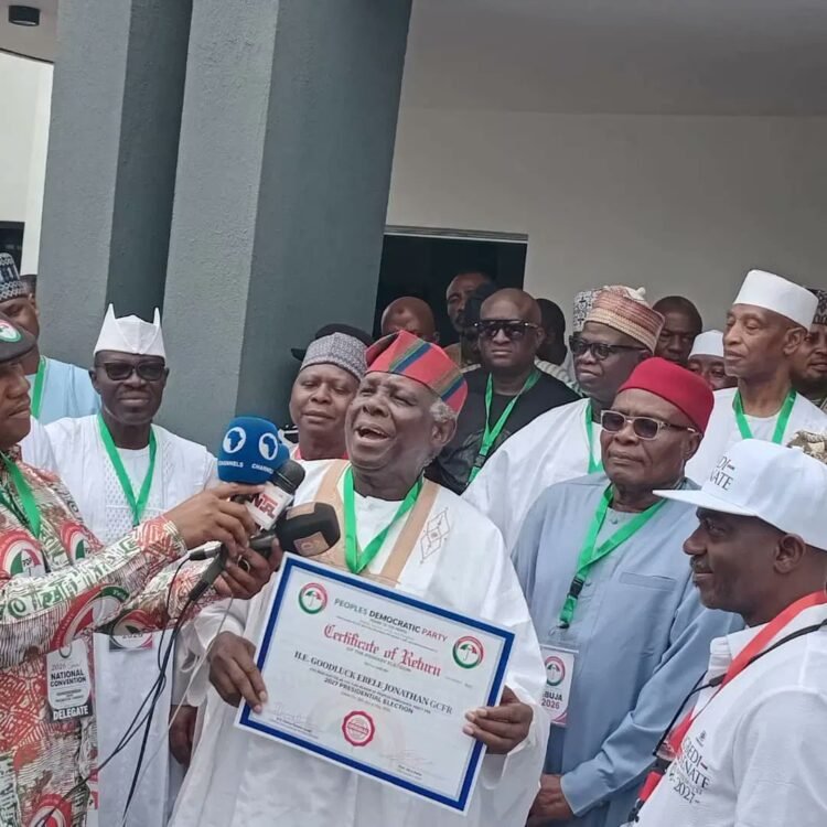 Jerry Gana Presents PDP Certificate To Jonathan 