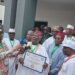 Jerry Gana Presents PDP Certificate To Jonathan 